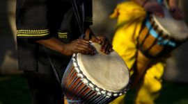 A person playing a drum in the Dominican Republic