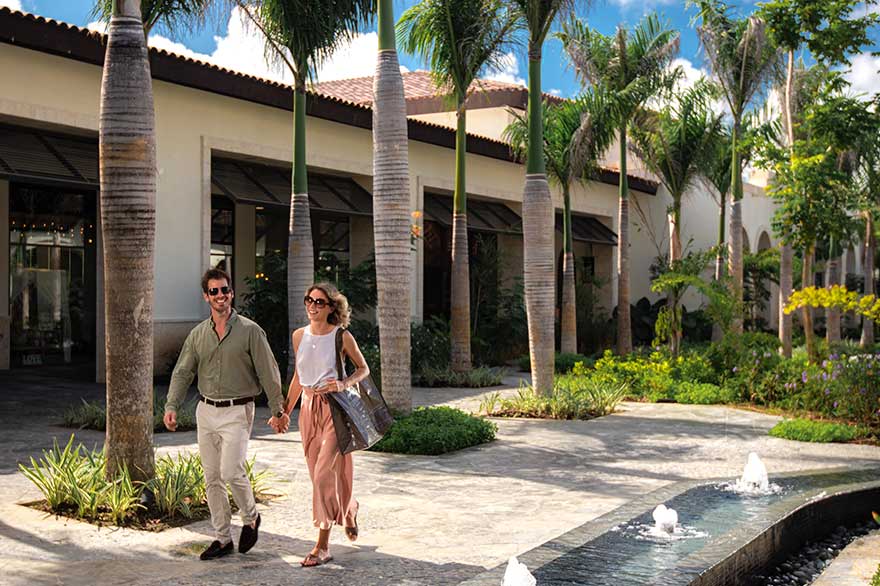 Couple walking along The Boulevard de Lopesan Costa Bávaro